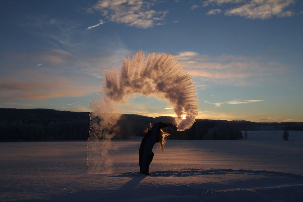 boiling water freezing weather snow winter throw sunset 